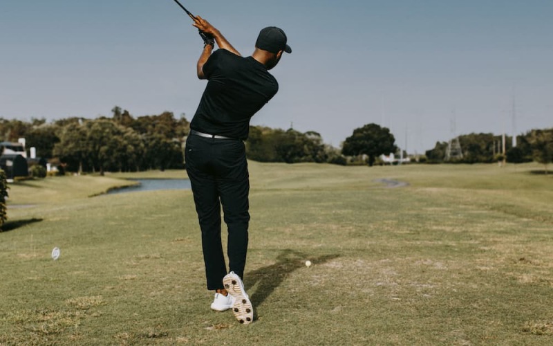 lifestyle image of a person playing golf