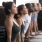 lifestyle image of women and men in a yoga pose